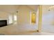 Open-concept living room with fireplace and plenty of natural light at 5502 Sapphire Cir, Ellenwood, GA 30294