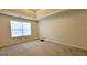 Cozy main bedroom with carpet flooring, featuring a bright window at 5502 Sapphire Cir, Ellenwood, GA 30294