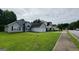 Neighborhood street view showcasing a home's appealing curb appeal and surrounding houses at 5502 Sapphire Cir, Ellenwood, GA 30294