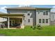 Spacious backyard with a covered patio, lawn, and privacy fence at 3711 Wartrace Dr, South Fulton, GA 30331
