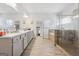 Bright bathroom featuring a double vanity, walk-in shower, and separate soaking tub at 3711 Wartrace Dr, South Fulton, GA 30331