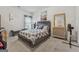 Inviting bedroom with plush carpet, gray accents, and serene decor, creating a relaxing ambiance at 3711 Wartrace Dr, South Fulton, GA 30331