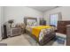 Cozy bedroom featuring warm yellow accents, carpet, and bedside tables with decorative lamps at 3711 Wartrace Dr, South Fulton, GA 30331