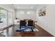 Cozy dining area with dark hardwood floors, modern table, and a view of sliding glass door to outdoor entertaining at 3711 Wartrace Dr, South Fulton, GA 30331