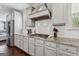Stylish kitchen with granite countertops, subway tile backsplash, stainless steel appliances, and custom gray cabinets at 3711 Wartrace Dr, South Fulton, GA 30331