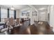 Open floor plan featuring hardwood floors, connecting the dining area and living room, creating an inviting and spacious feel at 3711 Wartrace Dr, South Fulton, GA 30331