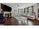 Bright living room featuring a fireplace, dark wood floors, and a comfortable sectional sofa at 3711 Wartrace Dr, South Fulton, GA 30331