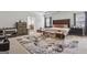 Spacious main bedroom featuring an ornate rug, tray ceilings, and a doorway to the en-suite bathroom at 3711 Wartrace Dr, South Fulton, GA 30331