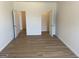 Spacious bedroom with wood floors and two doors at 1238 Polk Xing, Mcdonough, GA 30252