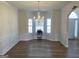Formal dining room with chandelier lighting, panel moulding, and large bright windows at 1238 Polk Xing, Mcdonough, GA 30252