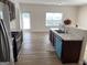 Open-concept kitchen with stainless steel appliances, modern countertops, and an eat-in area at 1238 Polk Xing, Mcdonough, GA 30252