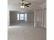 Spacious living room with neutral carpet and an bay window providing ample natural light at 1238 Polk Xing, Mcdonough, GA 30252