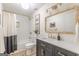 Stylish bathroom with a dark vanity, modern fixtures, and a shower-tub combination at 4023 Anvil Block Rd, Ellenwood, GA 30294