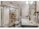 Stylish bathroom features a floral shower curtain, modern vanity, and elegant decor at 4023 Anvil Block Rd, Ellenwood, GA 30294