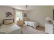 Charming bedroom featuring two twin beds with matching decor and natural light at 4023 Anvil Block Rd, Ellenwood, GA 30294