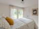 Bright bedroom with white walls, natural light, and tasteful decor at 4023 Anvil Block Rd, Ellenwood, GA 30294