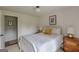 Bright bedroom with a white bed frame, stylish bedding, and modern decor at 4023 Anvil Block Rd, Ellenwood, GA 30294