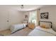 Charming bedroom featuring two twin beds with matching decor and natural light at 4023 Anvil Block Rd, Ellenwood, GA 30294