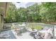 Relaxing outdoor deck area featuring a dining table and comfortable seating at 4023 Anvil Block Rd, Ellenwood, GA 30294