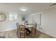 Dining area with a round table, four chairs, and bright natural lighting at 4023 Anvil Block Rd, Ellenwood, GA 30294