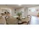Spacious dining area featuring a large round table with seating and stylish decor at 4023 Anvil Block Rd, Ellenwood, GA 30294