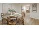Bright and open dining room with a large round table and seating for four at 4023 Anvil Block Rd, Ellenwood, GA 30294