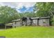 Single-story home with inviting front porch and meticulous landscaping at 4023 Anvil Block Rd, Ellenwood, GA 30294