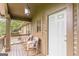Inviting front porch with rocking chairs and plenty of room to relax at 4023 Anvil Block Rd, Ellenwood, GA 30294