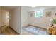 Small laundry room with a window for natural light and charming wall decor at 4023 Anvil Block Rd, Ellenwood, GA 30294