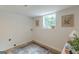 Bright laundry room with a window, floral prints, and modern washer/dryer hookups at 4023 Anvil Block Rd, Ellenwood, GA 30294