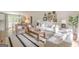 Inviting living room features neutral walls, hardwood floors, a decorative rug, and plush furnishings at 4023 Anvil Block Rd, Ellenwood, GA 30294