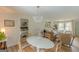Open-concept living space showcasing dining area and living room with natural light, neutral color palette and cozy seating at 4023 Anvil Block Rd, Ellenwood, GA 30294