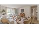 Spacious living room features neutral walls, hardwood floors, a decorative rug, and a door to the outside at 4023 Anvil Block Rd, Ellenwood, GA 30294