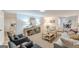 Open-concept living room features stylish furniture, a console table, and seamless flow at 4023 Anvil Block Rd, Ellenwood, GA 30294