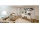 Bright home office with light wood floors, neutral walls, stylish décor, and a comfortable armchair at 4023 Anvil Block Rd, Ellenwood, GA 30294