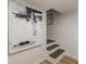 Stairwell with modern art and neutral color palette leading up at 4023 Anvil Block Rd, Ellenwood, GA 30294