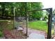 Fenced backyard with a mix of brick and gravel pathway and expansive grassy area at 155 Granby Ln, Fayetteville, GA 30215