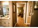 Bathroom view with the hallway in the background. Features sink, faucet, toilet and shower at 155 Granby Ln, Fayetteville, GA 30215
