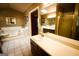 Bright bathroom featuring a double sink vanity, framed mirror and a separate tub and shower at 155 Granby Ln, Fayetteville, GA 30215