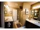 Well-lit bathroom featuring a shower, dual vanity sinks, and neutral tile flooring at 155 Granby Ln, Fayetteville, GA 30215