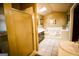 Spacious bathroom featuring a step-up tub, tiled floor, and separate shower, offering a luxurious feel at 155 Granby Ln, Fayetteville, GA 30215
