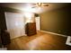 Bedroom with hardwood floors, ample closet space, and ceiling fan at 155 Granby Ln, Fayetteville, GA 30215
