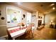 Dining room features a wood table and chairs with a view into the Gathering room and fireplace at 155 Granby Ln, Fayetteville, GA 30215