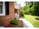 Brick exterior with black shutters, landscaping, and walkway at 155 Granby Ln, Fayetteville, GA 30215