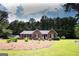 Charming brick home with a well-manicured lawn and complementary landscaping at 155 Granby Ln, Fayetteville, GA 30215