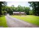Inviting home with a long driveway and spacious front yard at 155 Granby Ln, Fayetteville, GA 30215