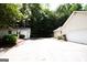 Detached two-car garage with a large paved driveway, offering ample parking space at 155 Granby Ln, Fayetteville, GA 30215