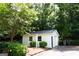 Cozy one-car garage with lush greenery, providing a serene backdrop at 155 Granby Ln, Fayetteville, GA 30215