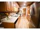 Modern kitchen with stainless steel appliances, granite countertops, and ample wooden cabinet space at 155 Granby Ln, Fayetteville, GA 30215