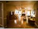 Open-concept living room with hardwood floors, brick fireplace and ample natural light at 155 Granby Ln, Fayetteville, GA 30215